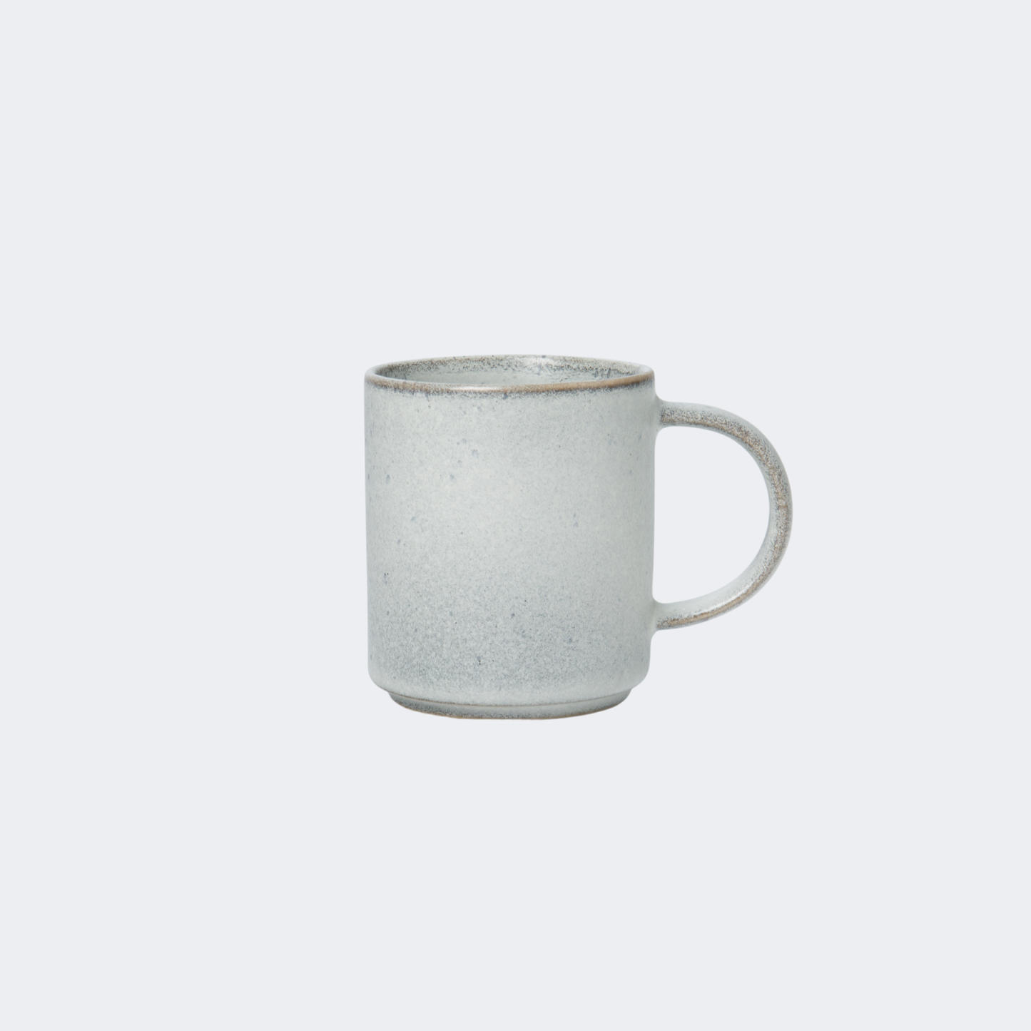 White ceramic mug on a light gray background