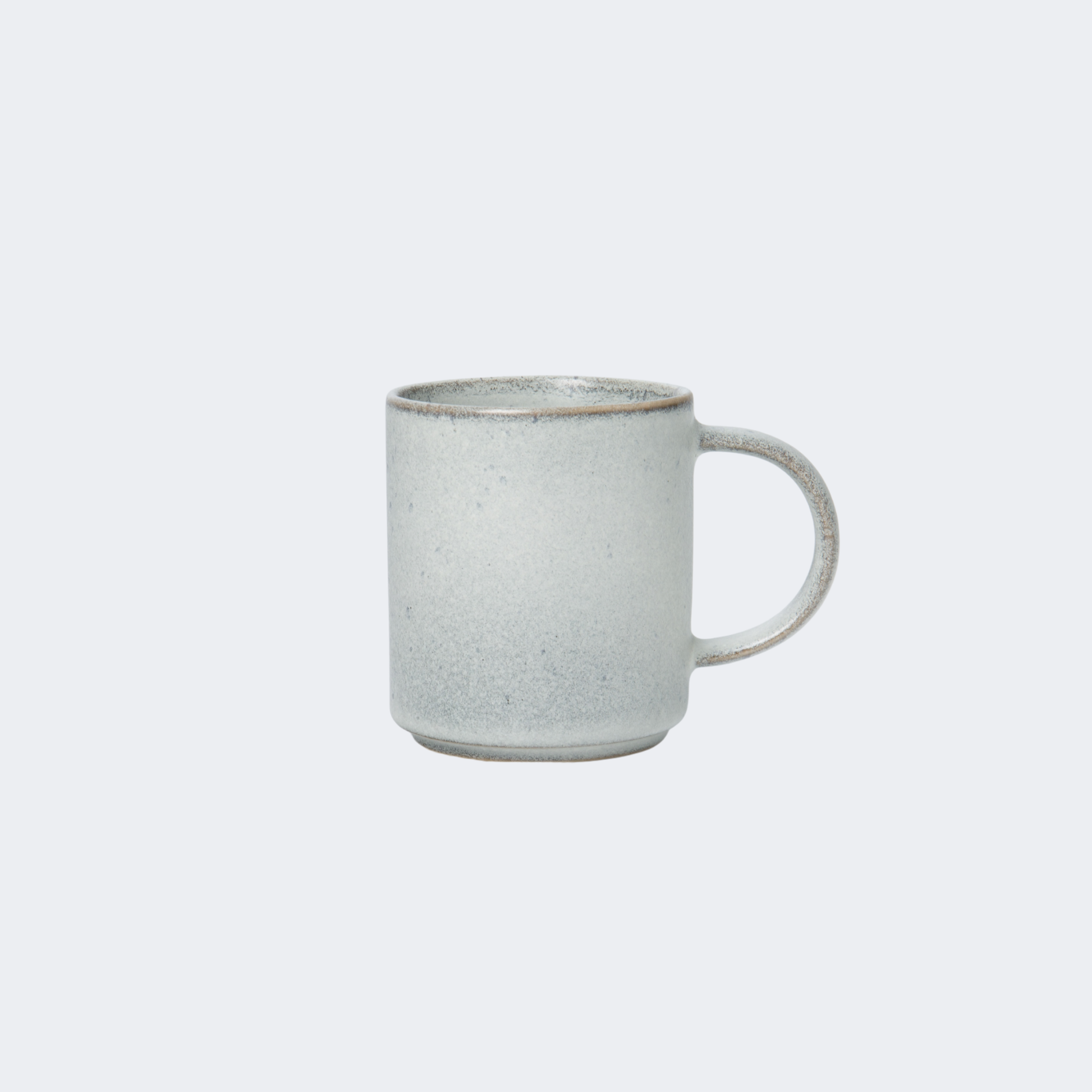 White ceramic mug on a light gray background