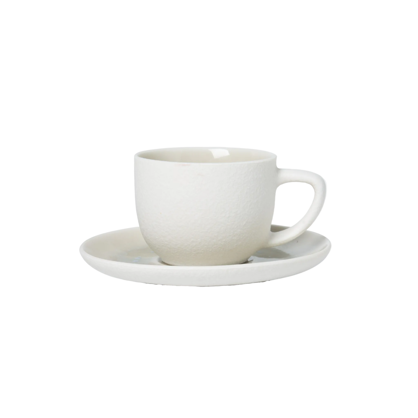 White ceramic cup and saucer on a light gray background