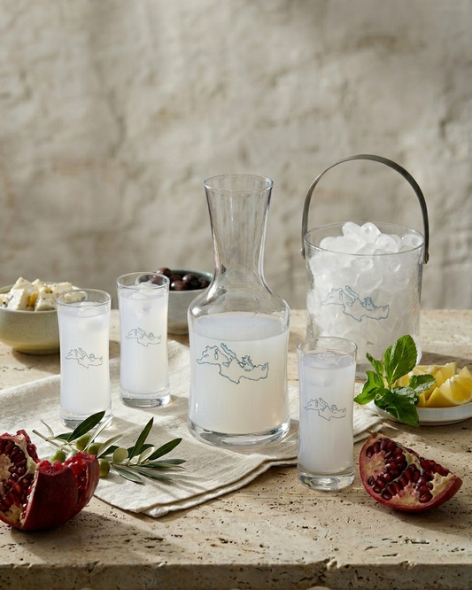 Mediterranean Arak, Ouzo and Raki glasses with carafe, ice and citrus